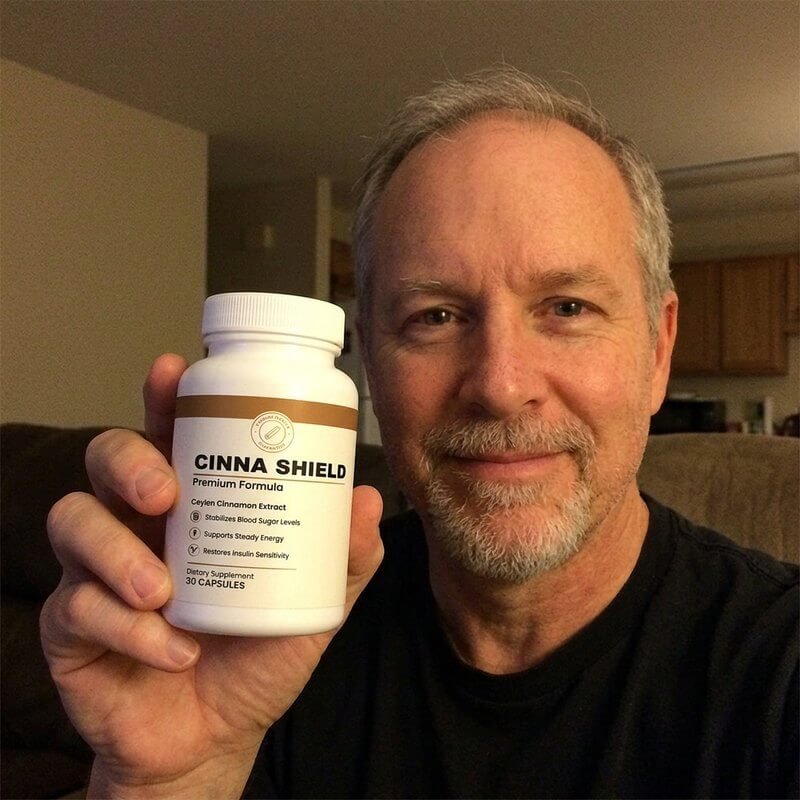 Cinna Shield customer holding their bottle